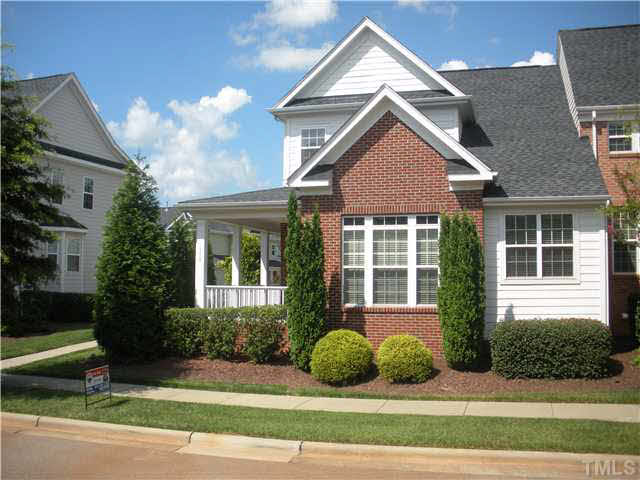 658 Democracy Street Raleigh, NC 27603 - Photo 4 of 25 a front view of a house with garden