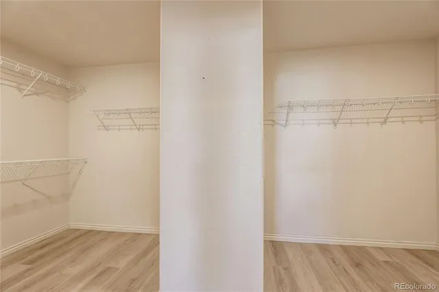 a bathroom with a sink double vanity granite and a large mirror
