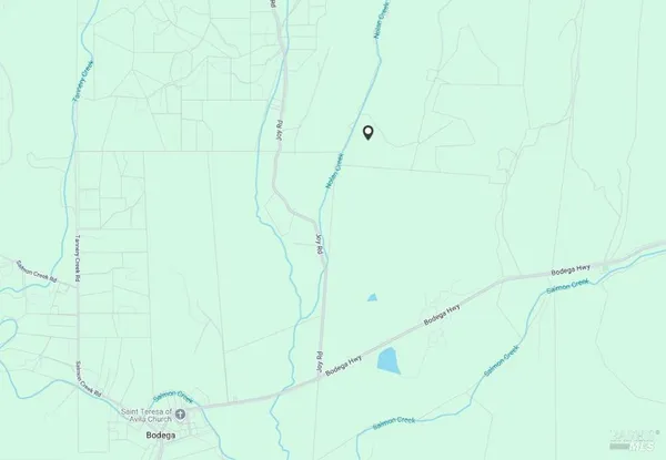 a view of a lake with a big yard