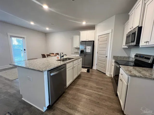 a living room with furniture rug and window
