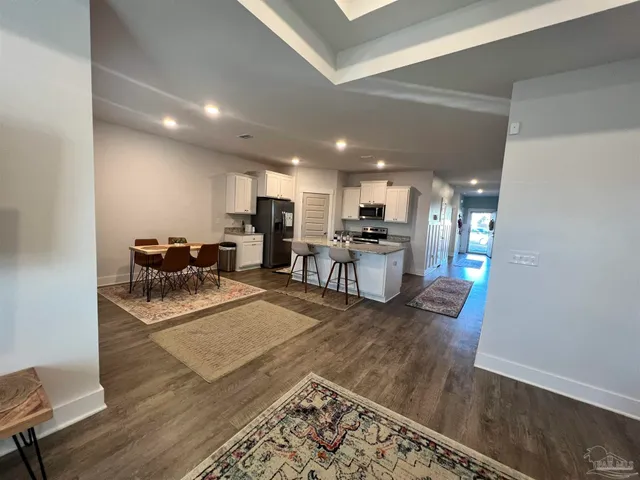 a kitchen with a refrigerator and a sink