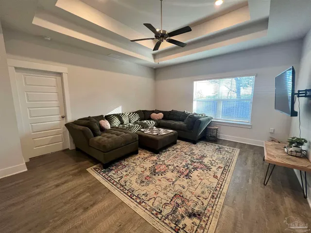 a bed sitting in a room next to a window