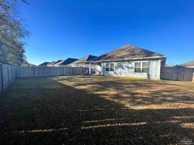 a view of a yard with an outdoor space