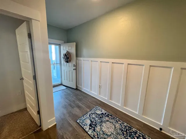 a view of entryway with wooden floor