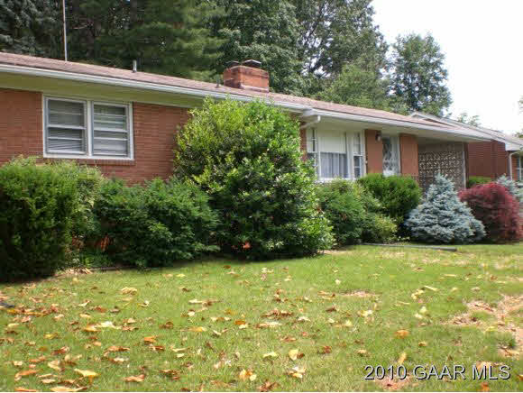 111 Robinhood Road Staunton, VA 24401 - Photo 1 of 5 a view of a backyard with plants and large tree