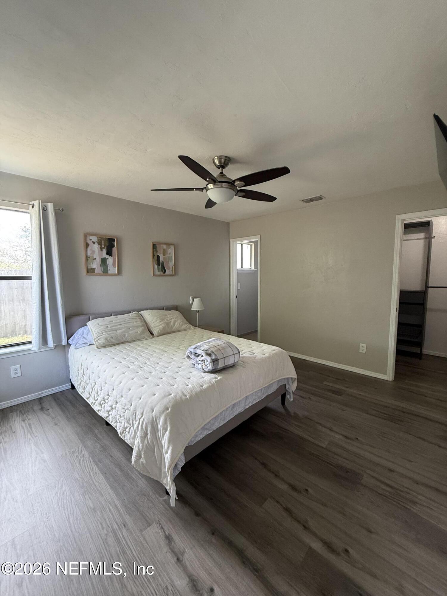 2360 Bitternut Way Jacksonville, FL 32246 - Photo 13 of 25 a bedroom with a bed and window