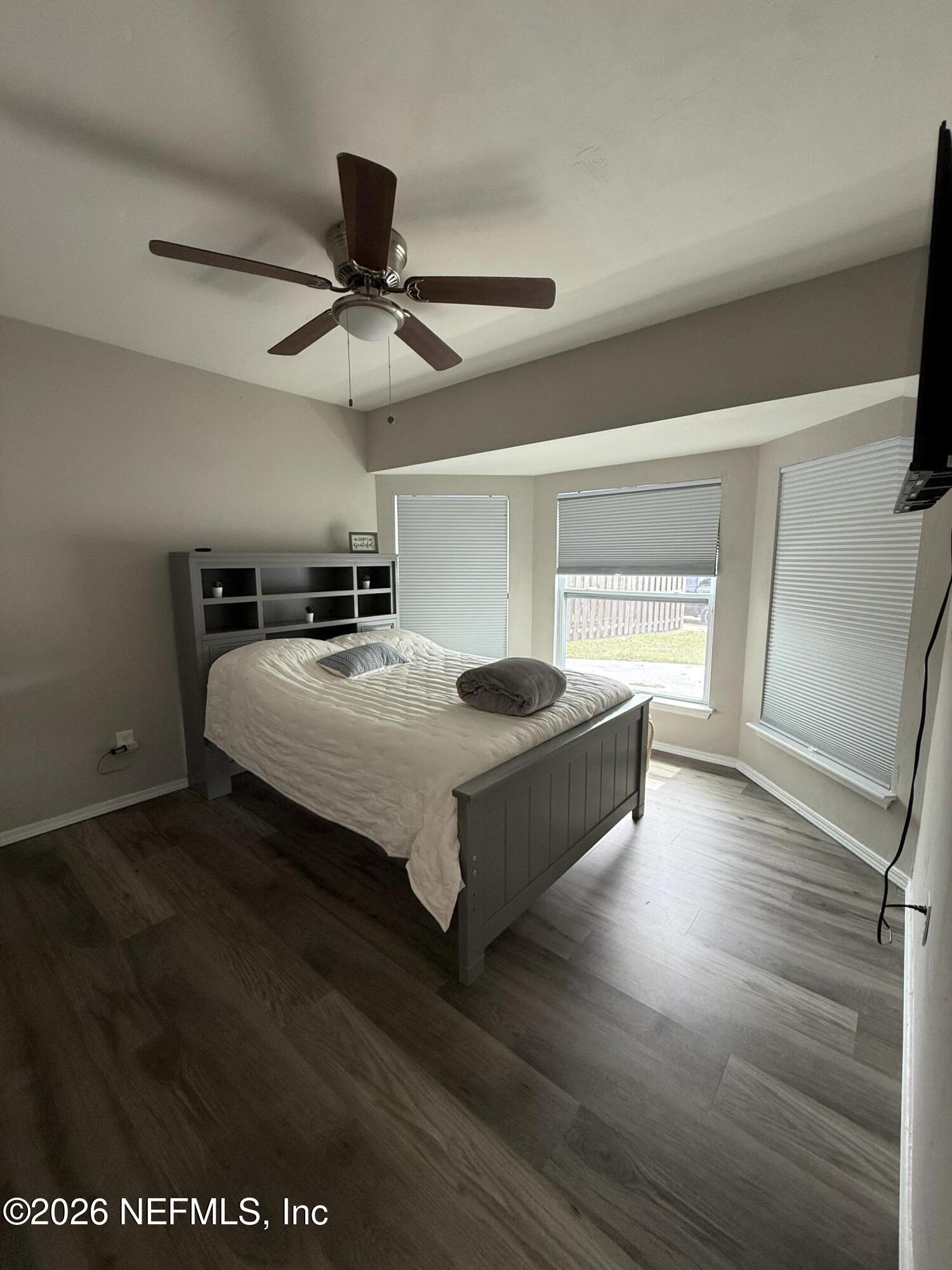 2360 Bitternut Way Jacksonville, FL 32246 - Photo 16 of 25 a living room with hard wood floors and a ceiling fan