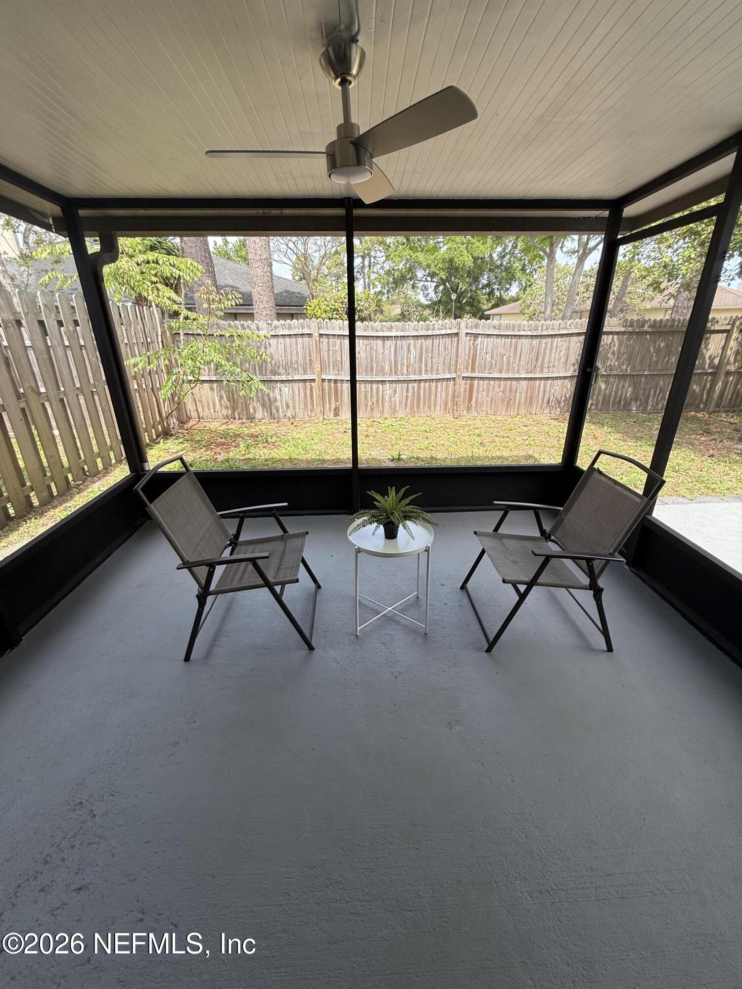 2360 Bitternut Way Jacksonville, FL 32246 - Photo 20 of 25 a room with large windows and furniture
