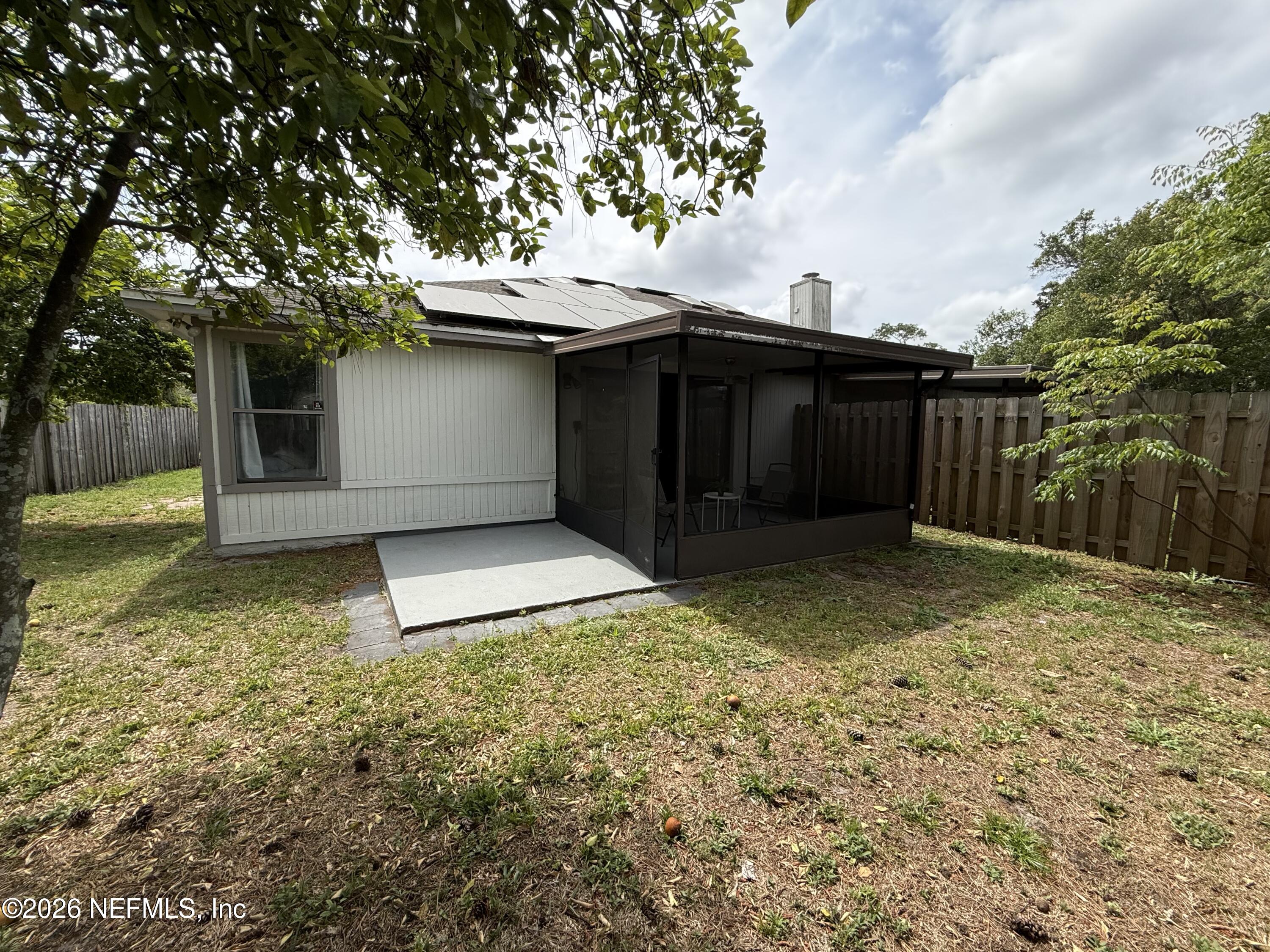 2360 Bitternut Way Jacksonville, FL 32246 - Photo 22 of 25 a backyard of a house with lots of green space