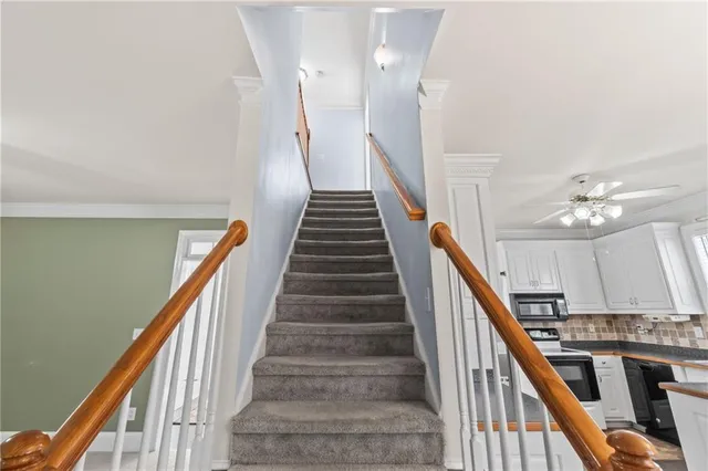 a bathroom with a sink a toilet a mirror and shower