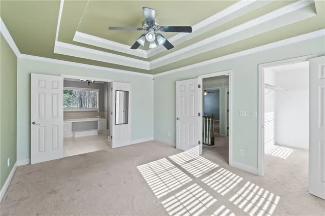 a bathroom with a tub a toilet and a sink