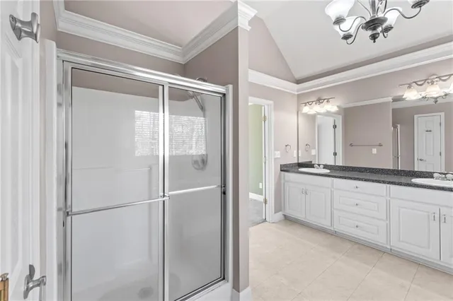 a view of a room with furniture and chandelier