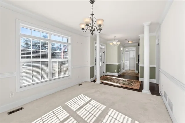 a kitchen with granite countertop a sink stainless steel appliances and cabinets