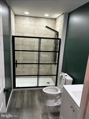 a bathroom with a toilet a sink and a shower