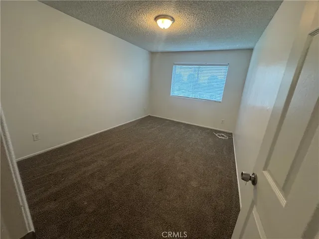 an empty room with a fan