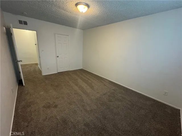 a view of a big room with carpet