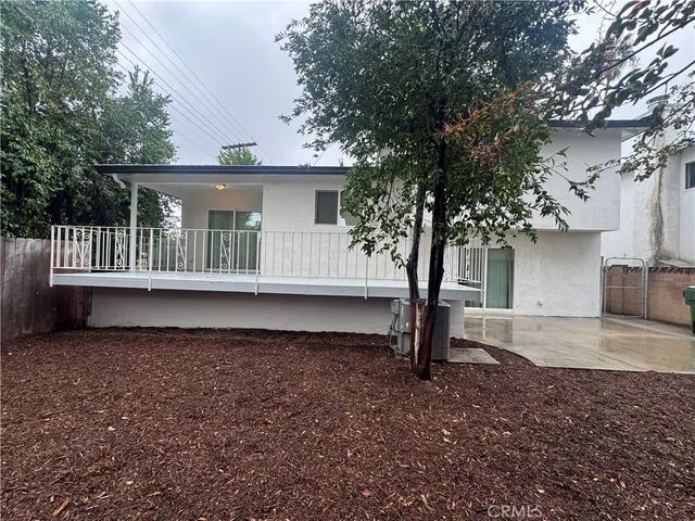 a view of outdoor space with deck and tree