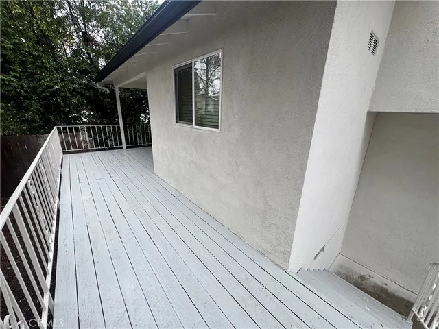 a view of deck with patio and wooden deck