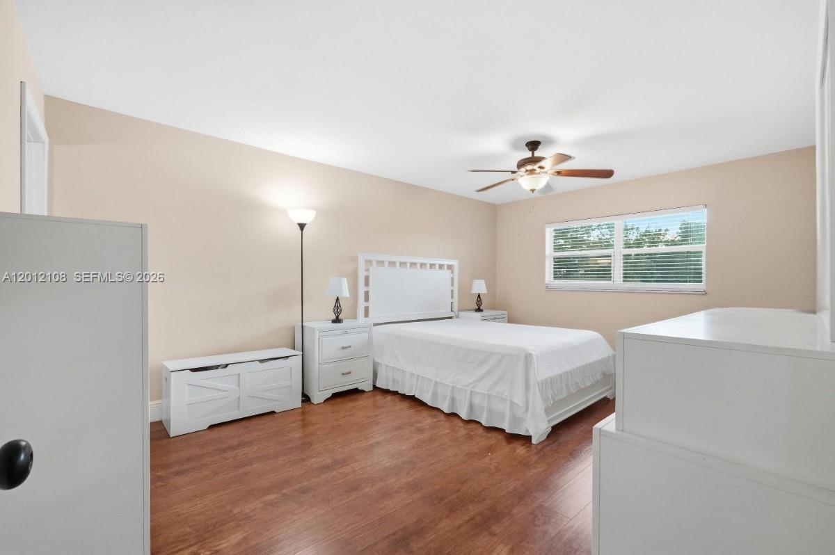 8826 West McNab Road, Unit 304 Tamarac, FL 33321 - Photo 14 of 22 a spacious bedroom with a bed and a window