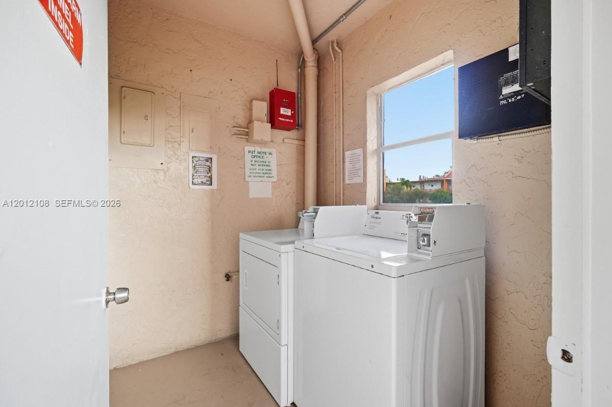 8826 West McNab Road, Unit 304 Tamarac, FL 33321 - Photo 19 of 22 a bathroom with a sink and a mirror