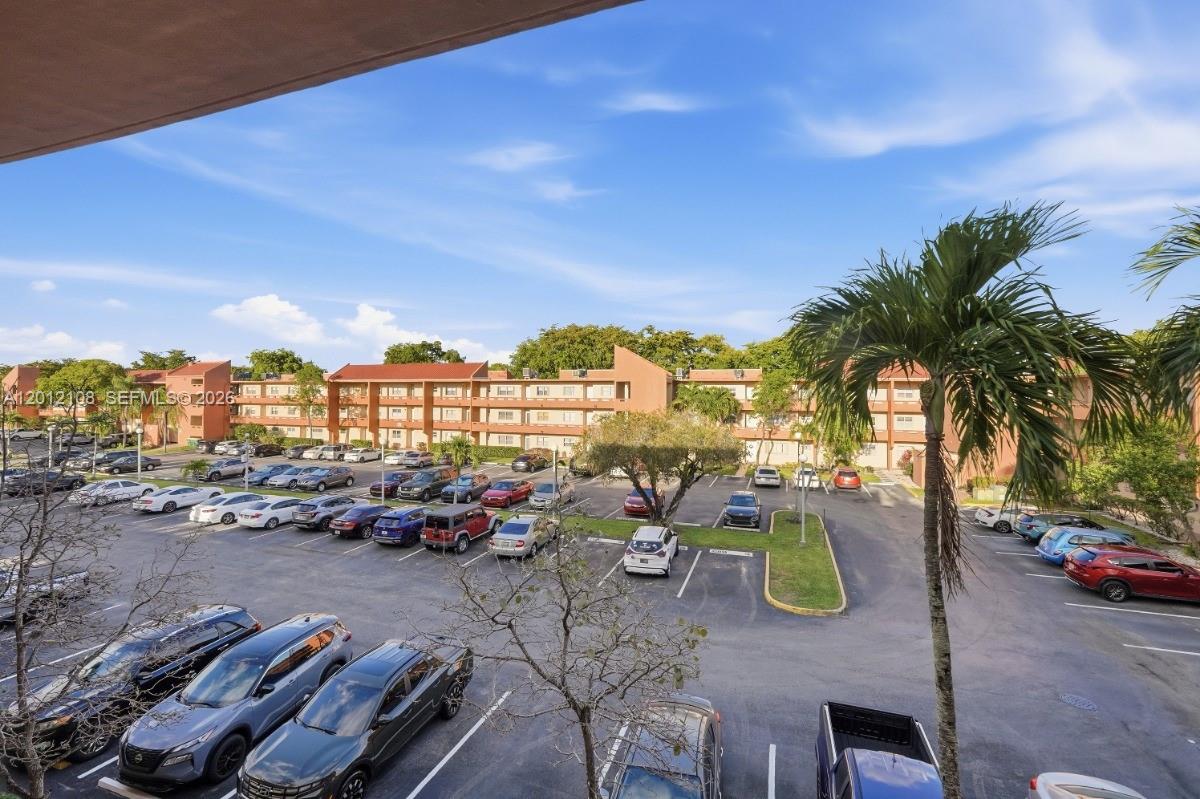 8826 West McNab Road, Unit 304 Tamarac, FL 33321 - Photo 21 of 22 a view of outdoor space with patio