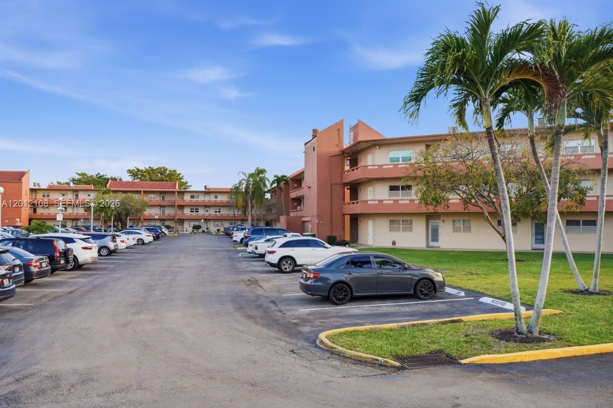 8826 West McNab Road, Unit 304 Tamarac, FL 33321 - Photo 22 of 22 a view of a street with cars