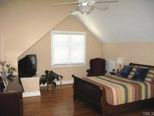 1502 Duplin Road Raleigh, NC 27607 - Photo 5 of 12 Grand master suite with cathedral ceiling, ceiling fan, sitting area, & walk-in closet Master Suite