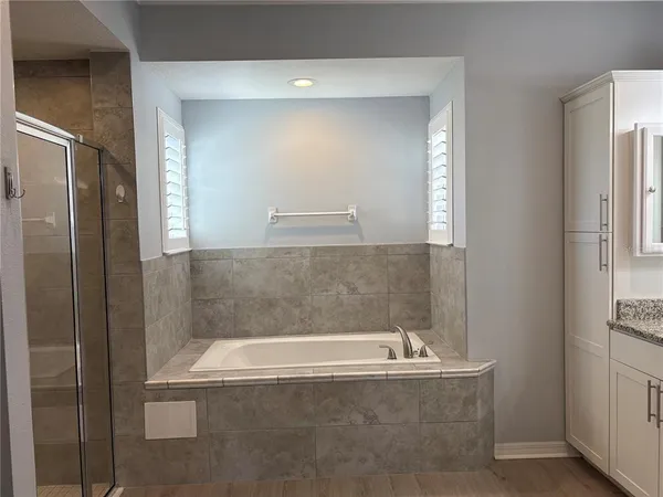 a bath tub sitting next to a bathroom