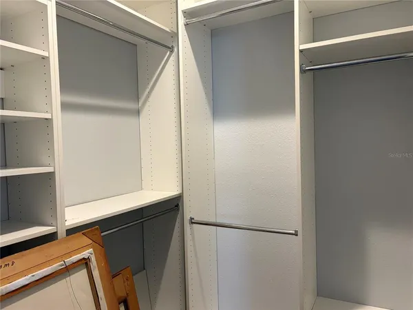 a white refrigerator freezer and a stove sitting inside of a refrigerator