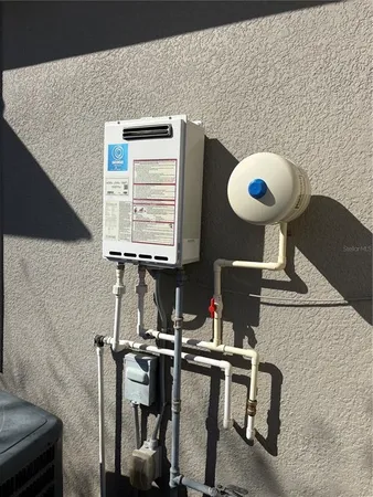 a utility room with a sink and a dryer