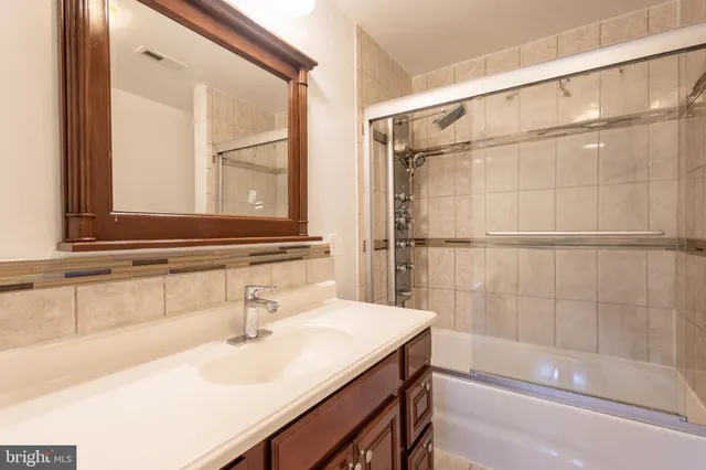a bathroom with a sink and a bathtub