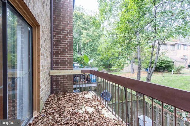 a view of a balcony with a tree
