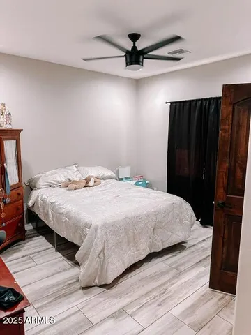 a bedroom with a bed and a walk in closet