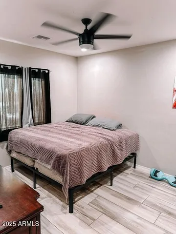 a bedroom with a bed and a walk in closet