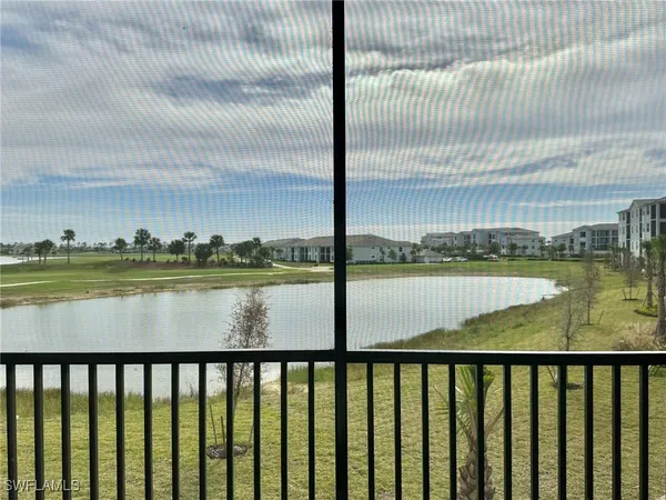 a view of lake with a big yard