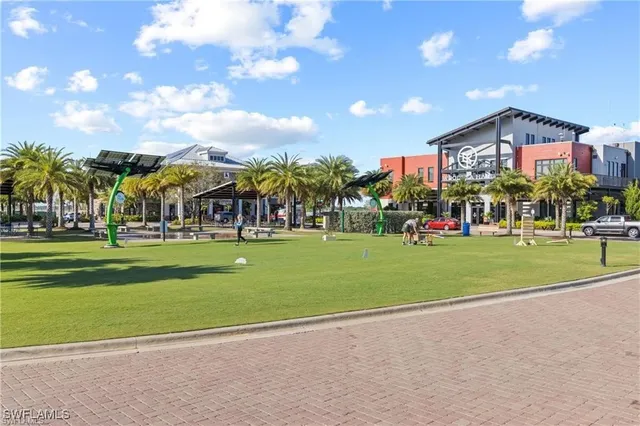 a view of a swimming pool with outdoor seating