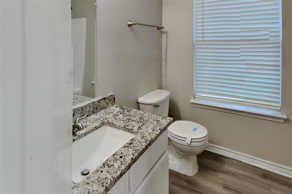 105 Independence Trail Forney, TX 75126 - Photo 16 of 18 a bathroom with a sink and a toilet