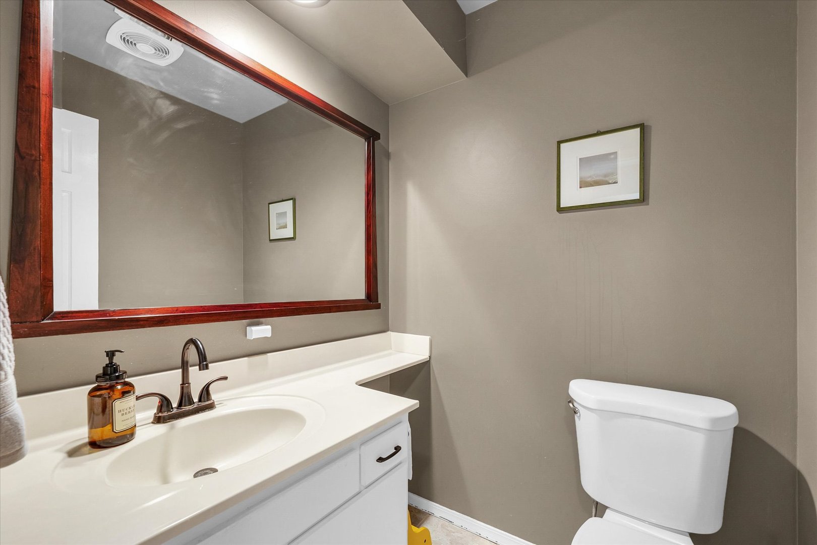 1727 Devonshire Drive Champaign, IL 61821 - Photo 14 of 48 a bathroom with a toilet sink and mirror