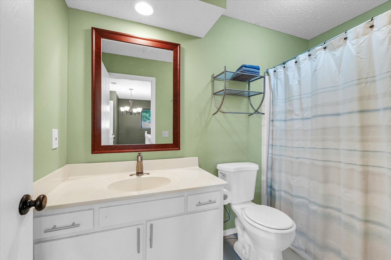 1727 Devonshire Drive Champaign, IL 61821 - Photo 30 of 48 a bathroom with a sink a toilet and mirror