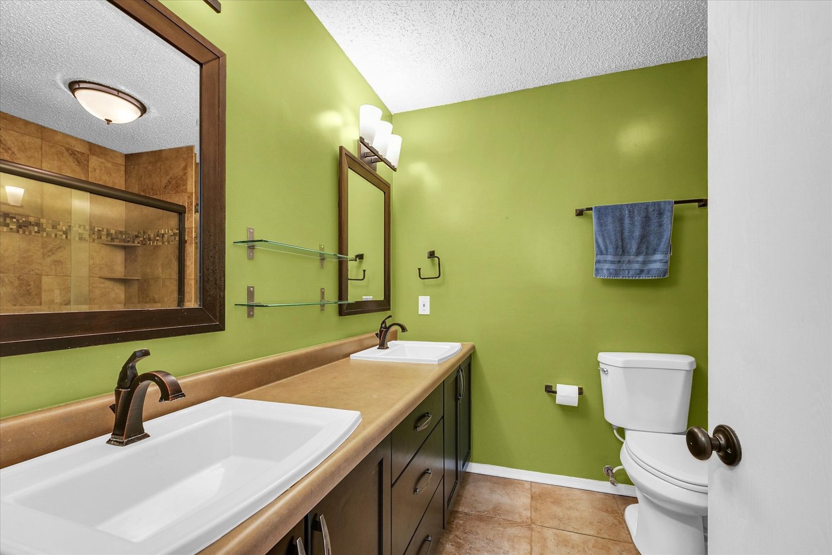 1727 Devonshire Drive Champaign, IL 61821 - Photo 34 of 48 a bathroom with a sink and a mirror