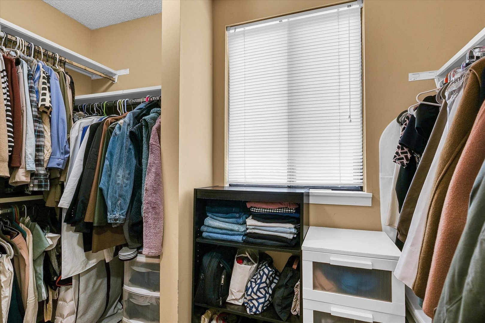 1727 Devonshire Drive Champaign, IL 61821 - Photo 35 of 48 a view of walk in closet with clothes and shoes