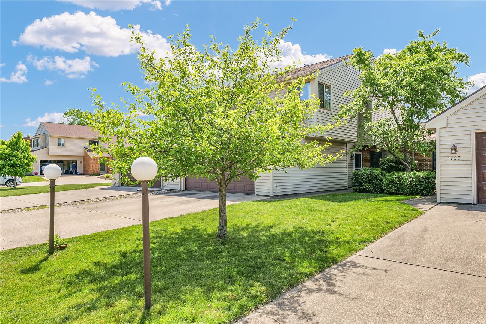 1727 Devonshire Drive Champaign, IL 61821 - Photo 42 of 48 a front view of a house with garden