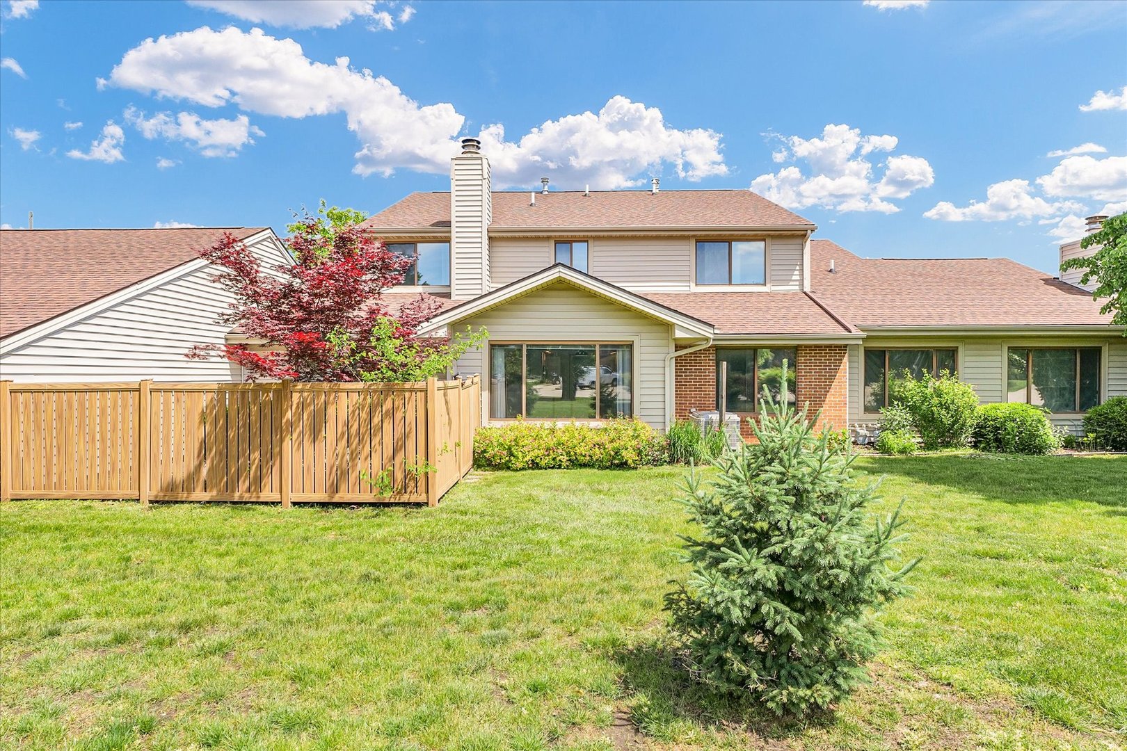 1727 Devonshire Drive Champaign, IL 61821 - Photo 44 of 48 a front view of a house with garden