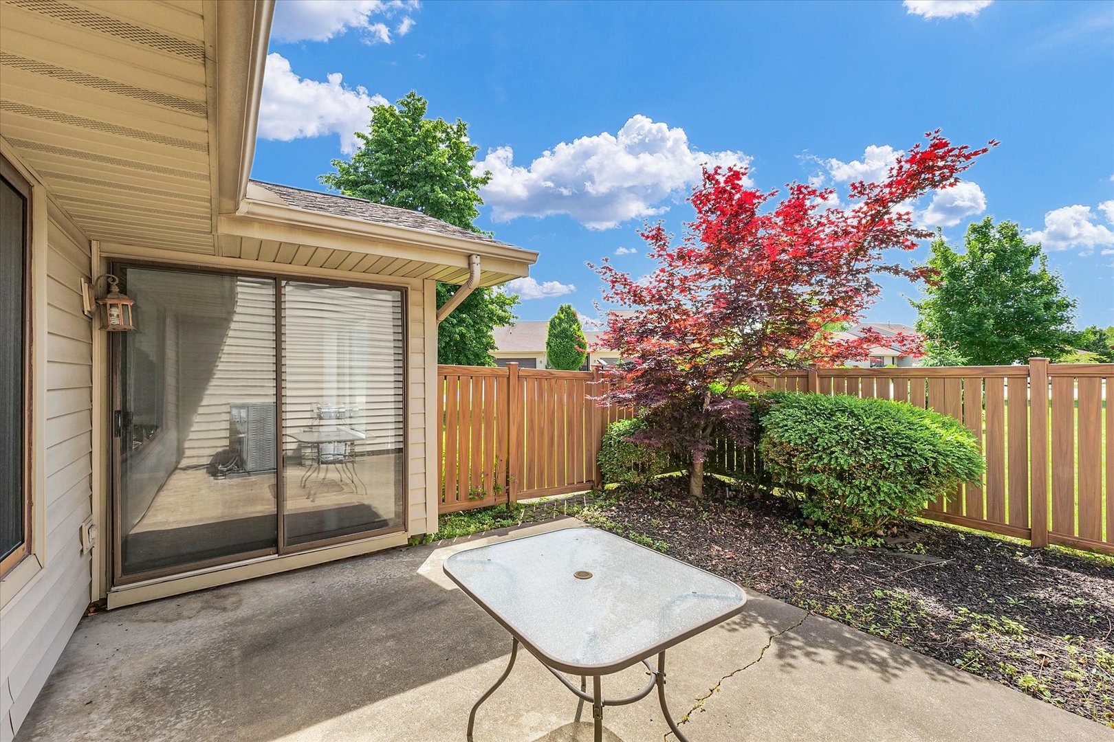 1727 Devonshire Drive Champaign, IL 61821 - Photo 46 of 48 a backyard of a house with table and chairs