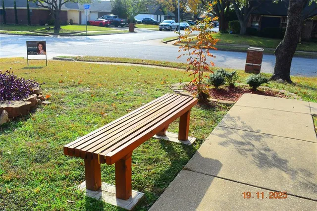 a view of a swimming pool with a patio and plants