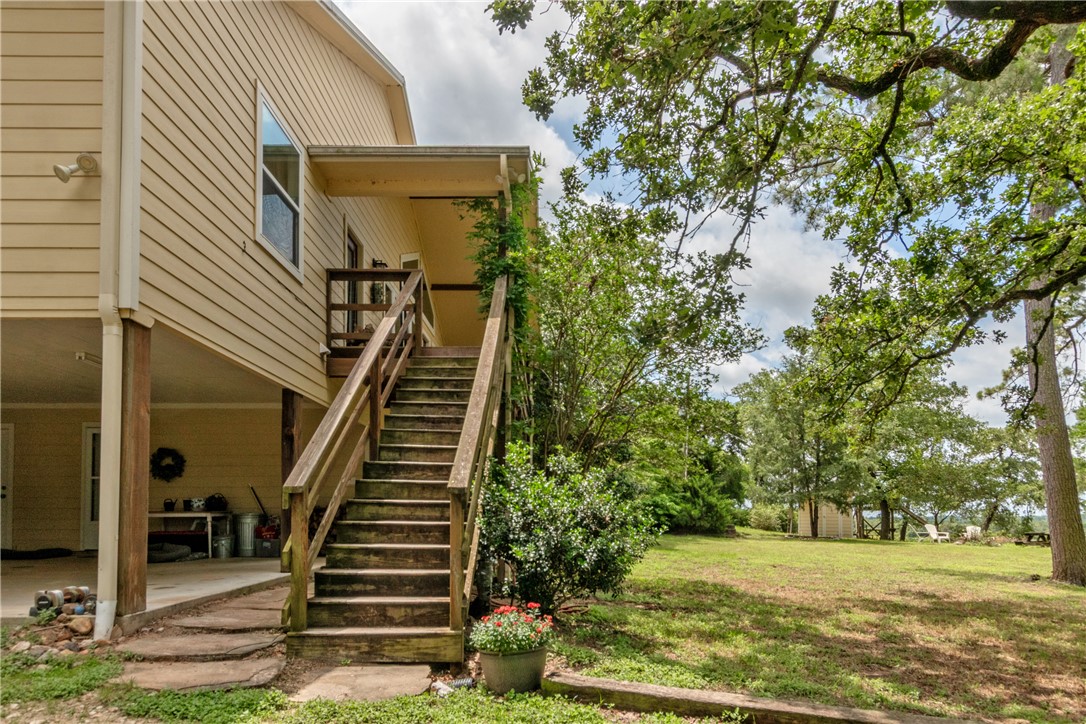 9997 Calhoun Road Bryan, TX 77808 - Photo 30 of 50 a view of a yard in front of a house with a fountain