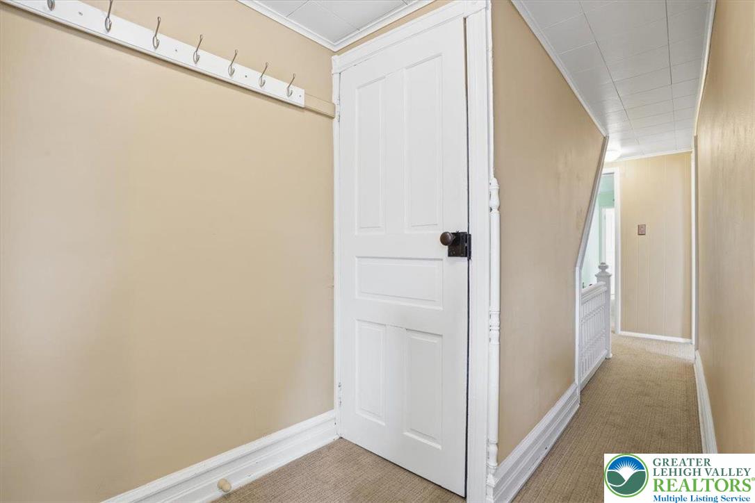 525 Ridge Street Emmaus, PA 18049 - Photo 50 of 68 This cozy hallway features a traditional door and durable carpet flooring, creating a welcoming atmosphere.