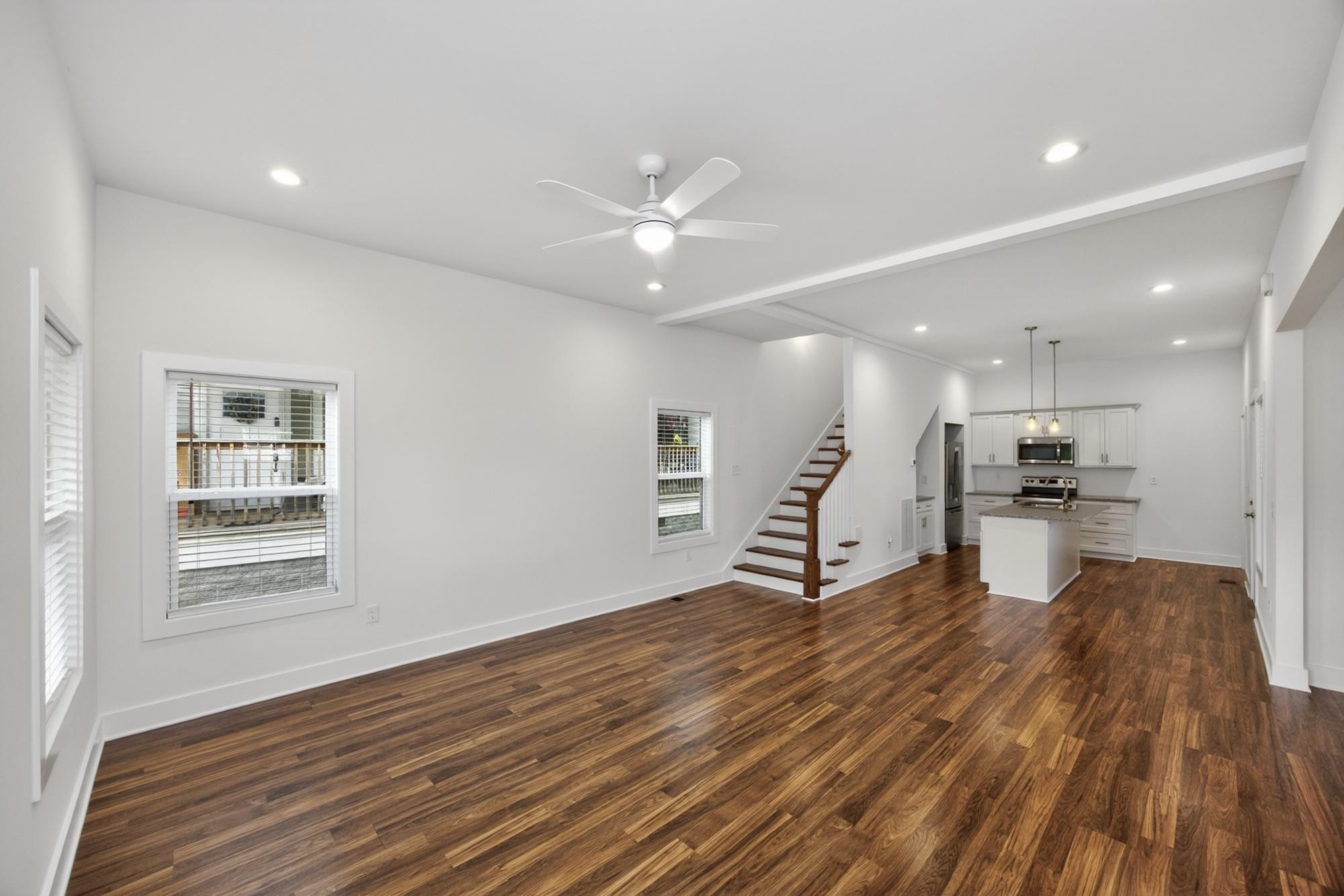 7 Decatur Street Nashville, TN 37210 - Photo 8 of 43 a living room with kitchen view and a wooden floor