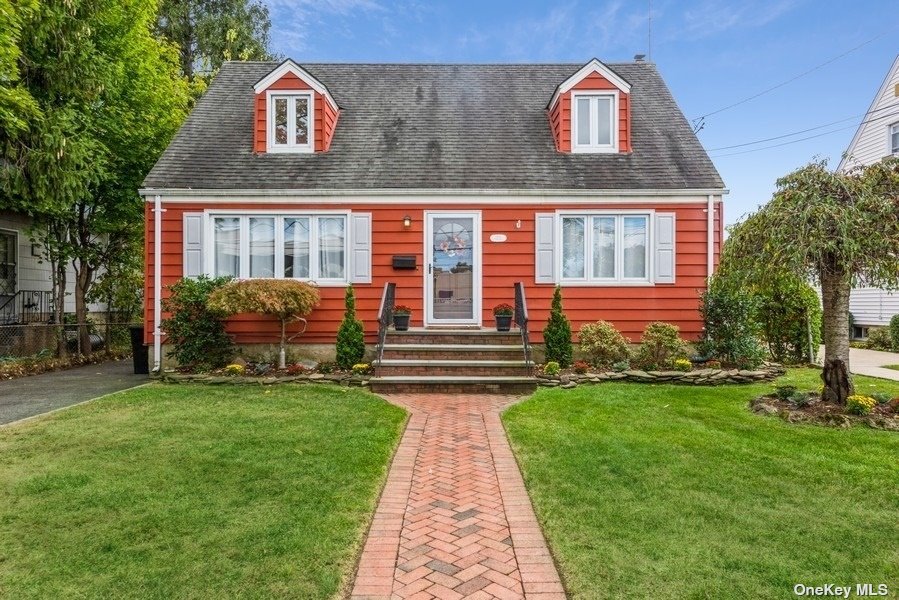 175 Rudolf Road Mineola, NY 11501 - Photo 1 of 1 a front view of a house with garden