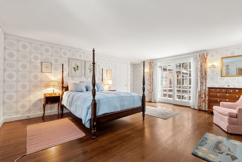 27 Laurel Road Chestnut Hill, MA 02467 - Photo 13 of 20 a bedroom with a bed wooden floor and lamp
